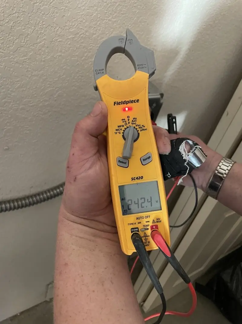 Voltage testing with clamp meter during Ceiling Fan Installation in Hudson
